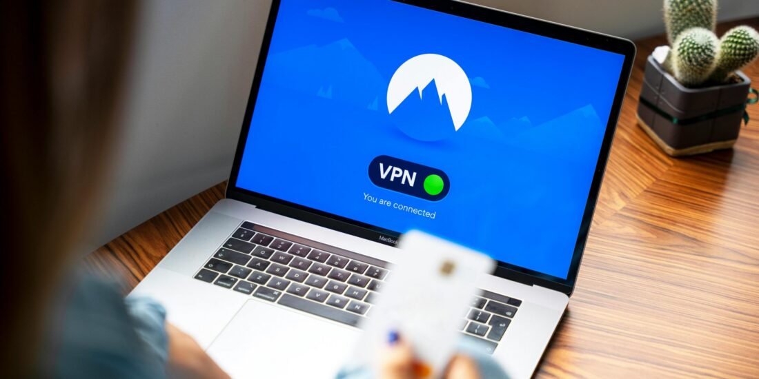 CrowdStrike NordVPN https://www.pexels.com/photo/macbook-pro-on-brown-wooden-table-5243610/