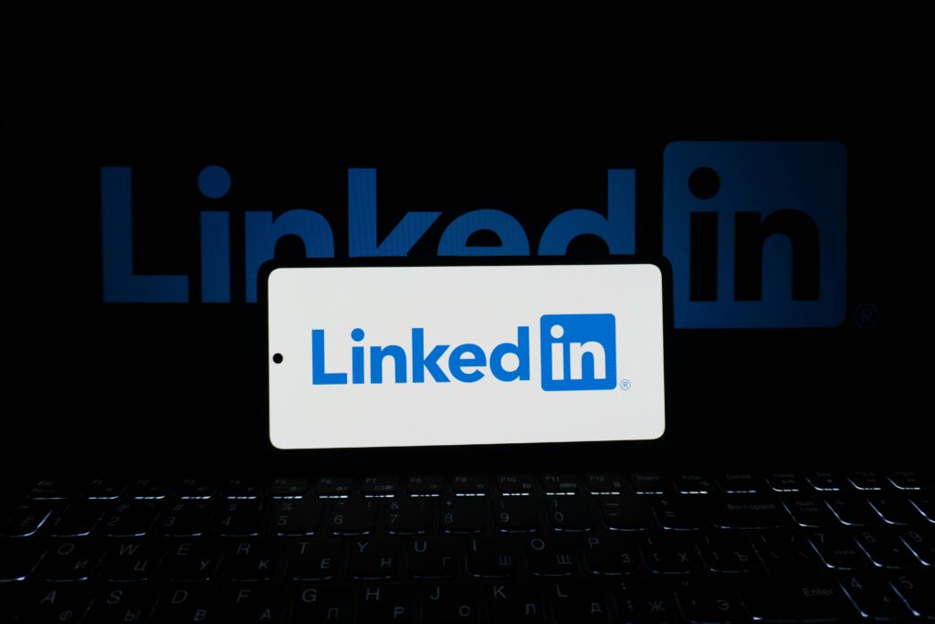 LinkedIn verified badge Persona https://www.pexels.com/photo/linkedin-logo-displayed-on-smartphone-and-laptop-33440526/