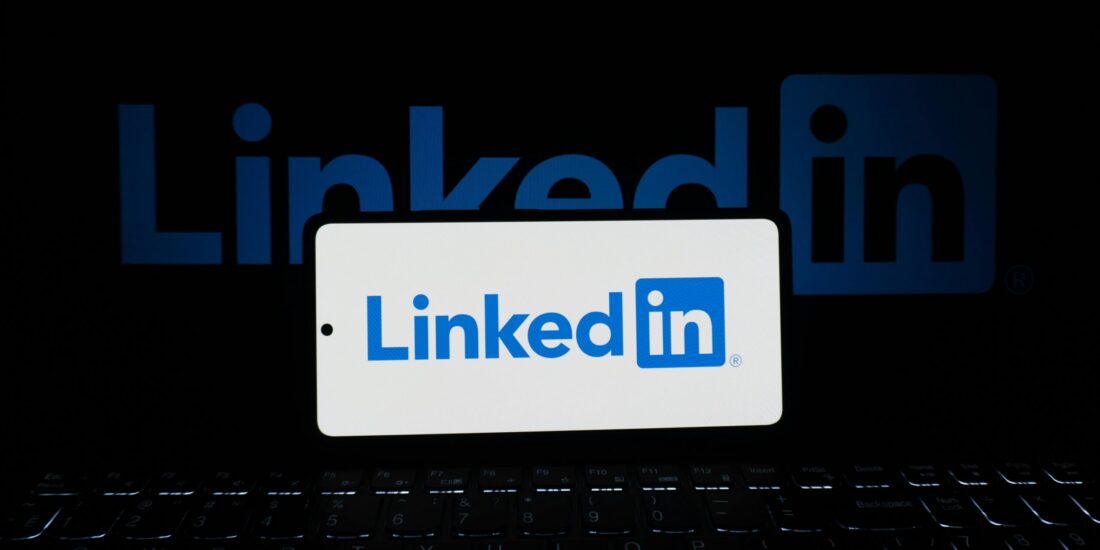 LinkedIn verified badge Persona https://www.pexels.com/photo/linkedin-logo-displayed-on-smartphone-and-laptop-33440526/