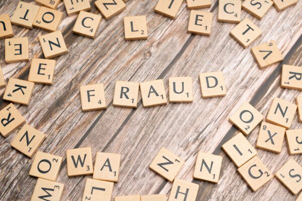 banking real-time fraud AI https://www.pexels.com/photo/the-word-fraud-spelled-out-in-scrabble-letters-19835552/