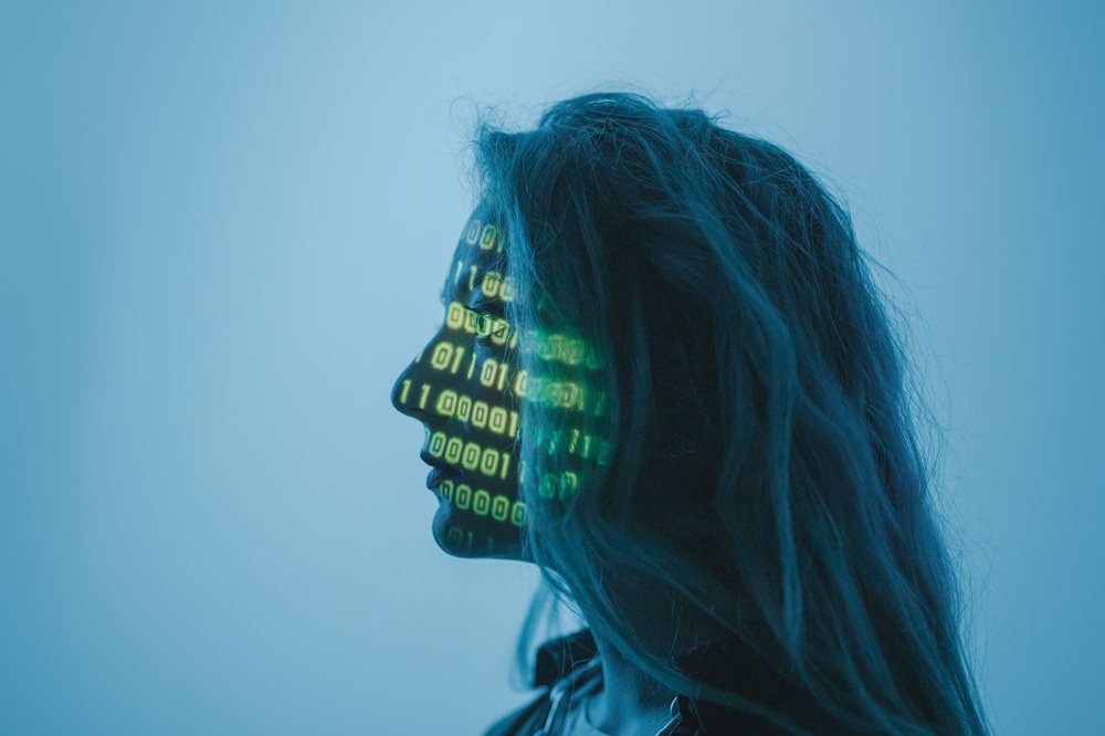 ambient technology facial recognition biometric https://www.pexels.com/photo/a-woman-with-number-code-on-her-face-while-looking-afar-5473956/