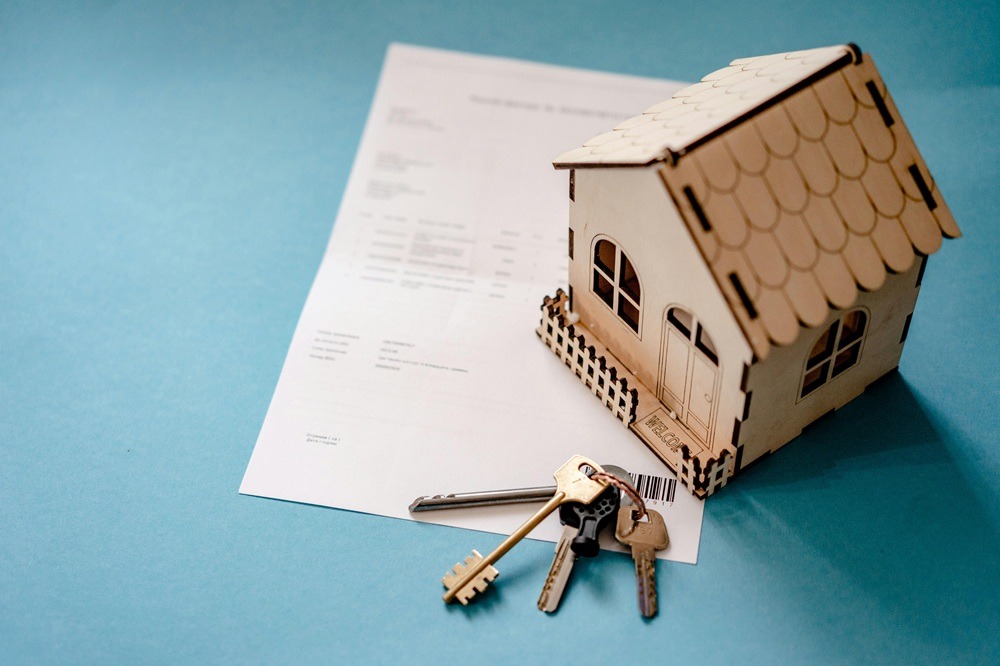 property records modernization https://www.pexels.com/photo/wooden-house-moder-keys-and-contract-on-table-12955837/