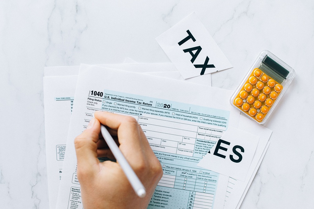 tax return financial planning https://www.pexels.com/photo/filing-tax-return-6863337/