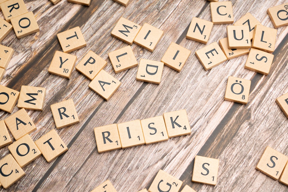 HITRUST risk IRIDEX https://www.pexels.com/photo/scrabble-letters-spelling-risk-on-a-wooden-table-19856611/