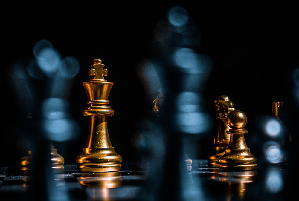 AI strategy https://www.pexels.com/photo/gold-chess-pieces-on-black-surface-6041464/