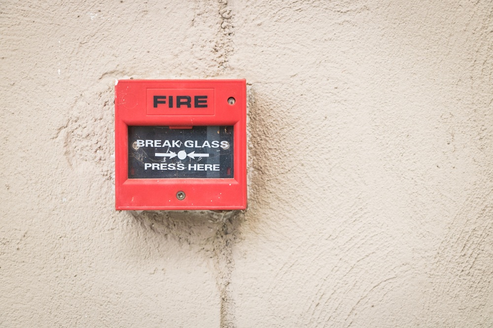integrated safety system https://www.pexels.com/photo/a-red-and-black-fire-alarm-control-13060860/