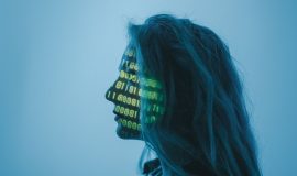 ambient technology facial recognition biometric https://www.pexels.com/photo/a-woman-with-number-code-on-her-face-while-looking-afar-5473956/