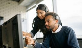 IT service IT support Panasonic Connect https://www.pexels.com/photo/a-man-and-a-woman-pointing-at-the-computer-screen-8867472/