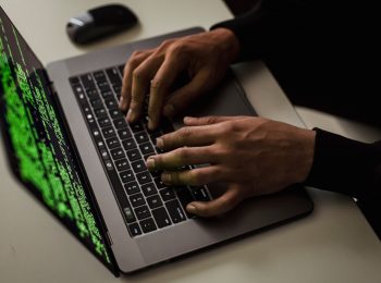 Cynet Settra ransomware https://www.pexels.com/photo/crop-cyber-spy-hacking-system-while-typing-on-laptop-5935794/